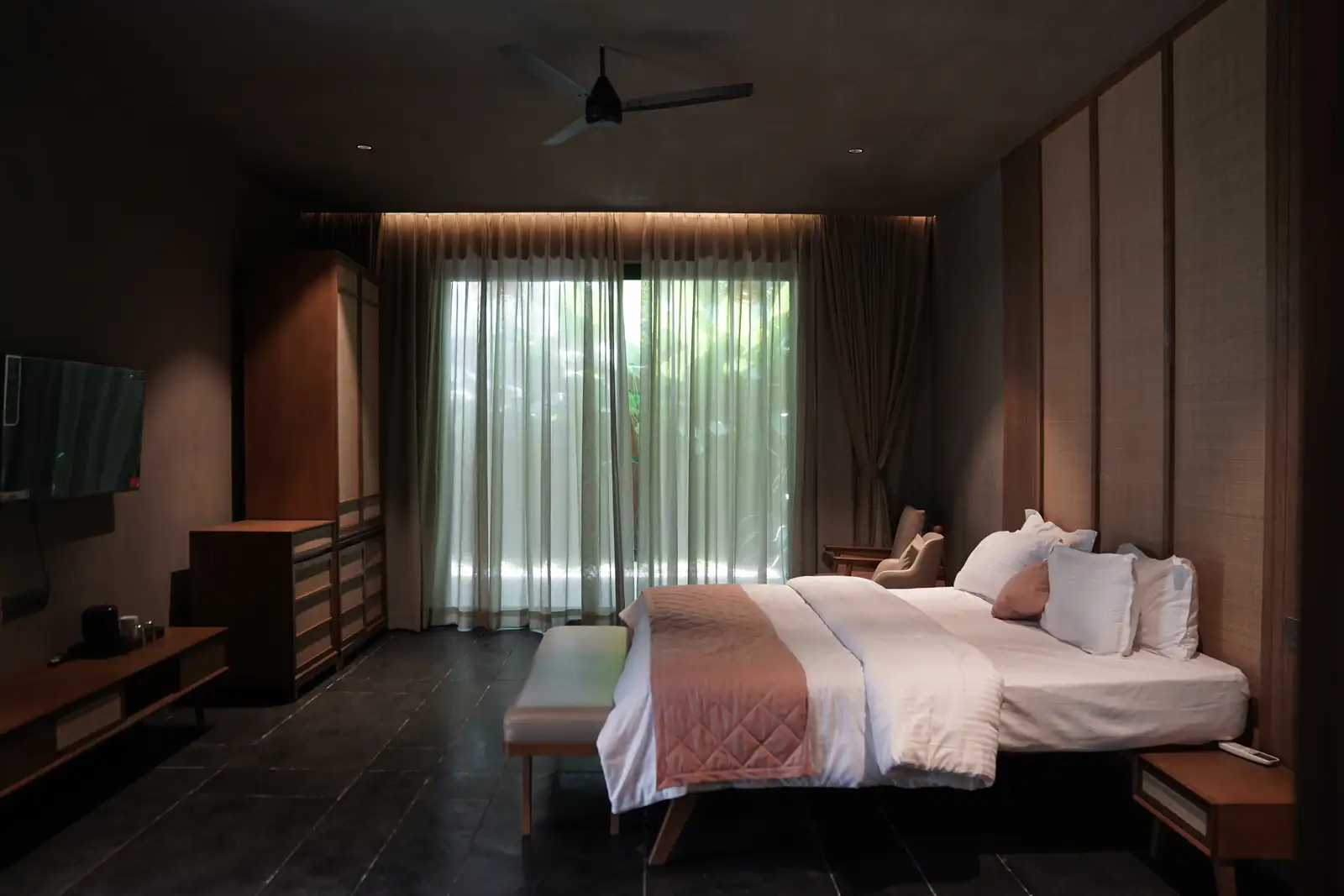 Warmly lit suite bedroom