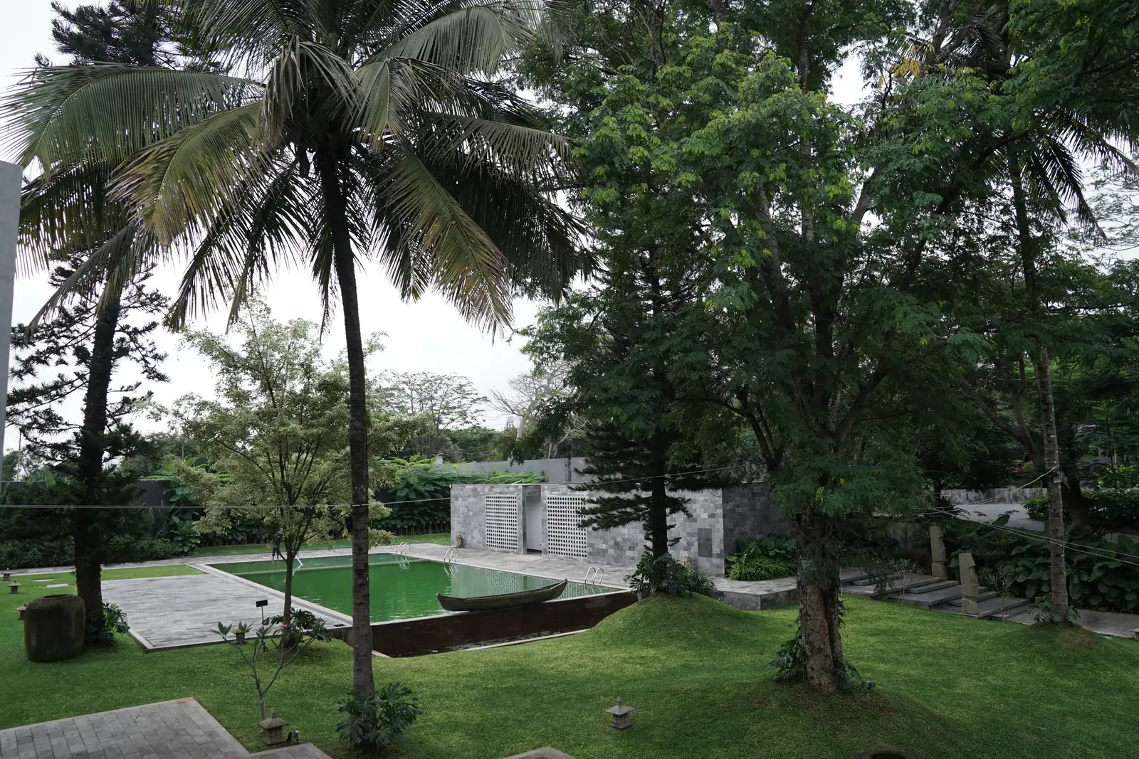 Pool with palms and rowboat